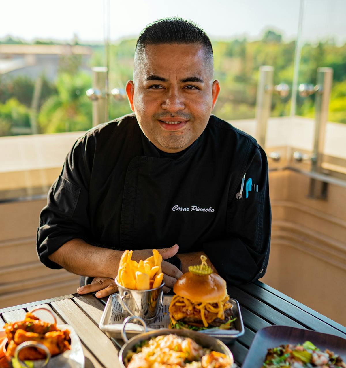 a man sitting at a table with a plate of food