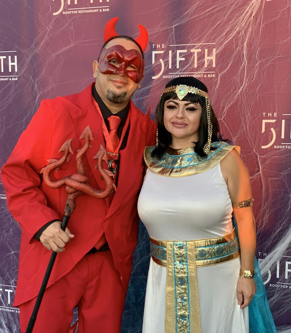 a man and woman in halloween costumes