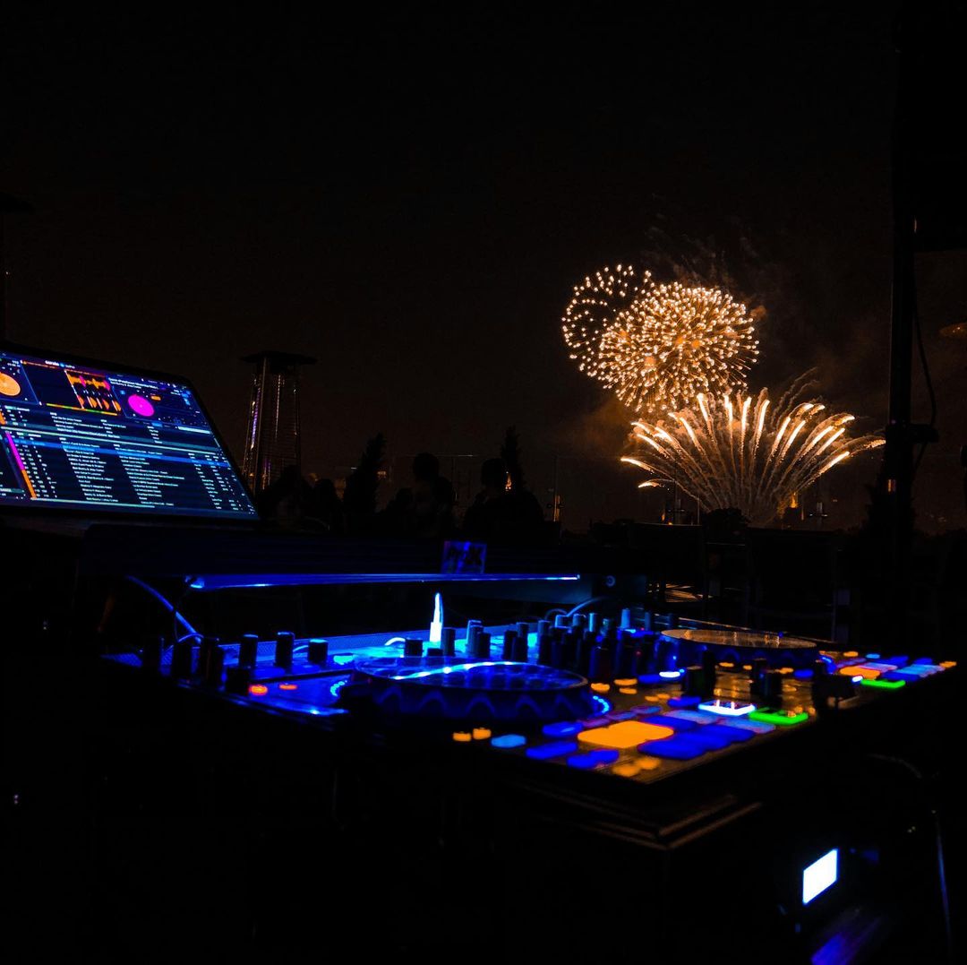a dj set and firework views