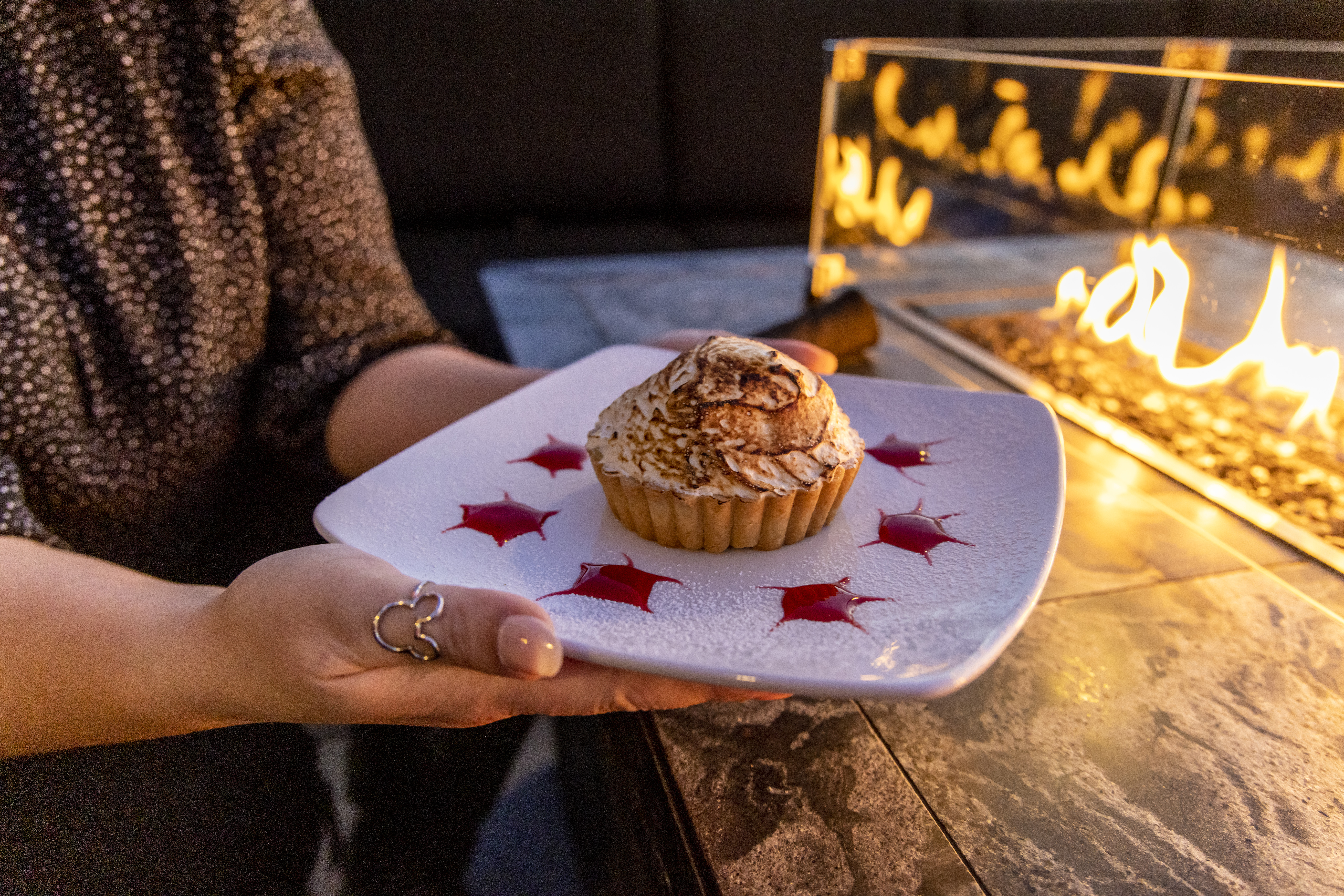 holding a lemon dessert