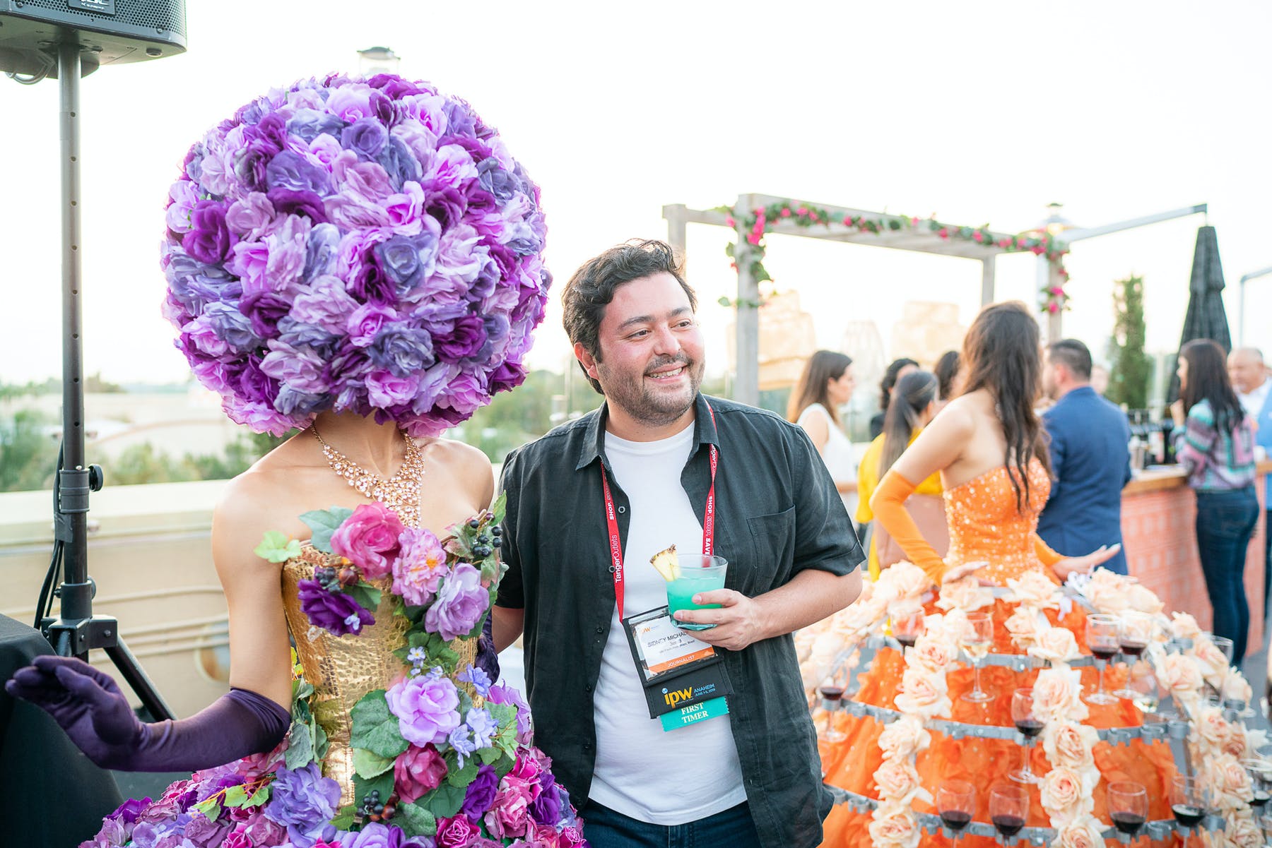 a person standing in front of a cake
