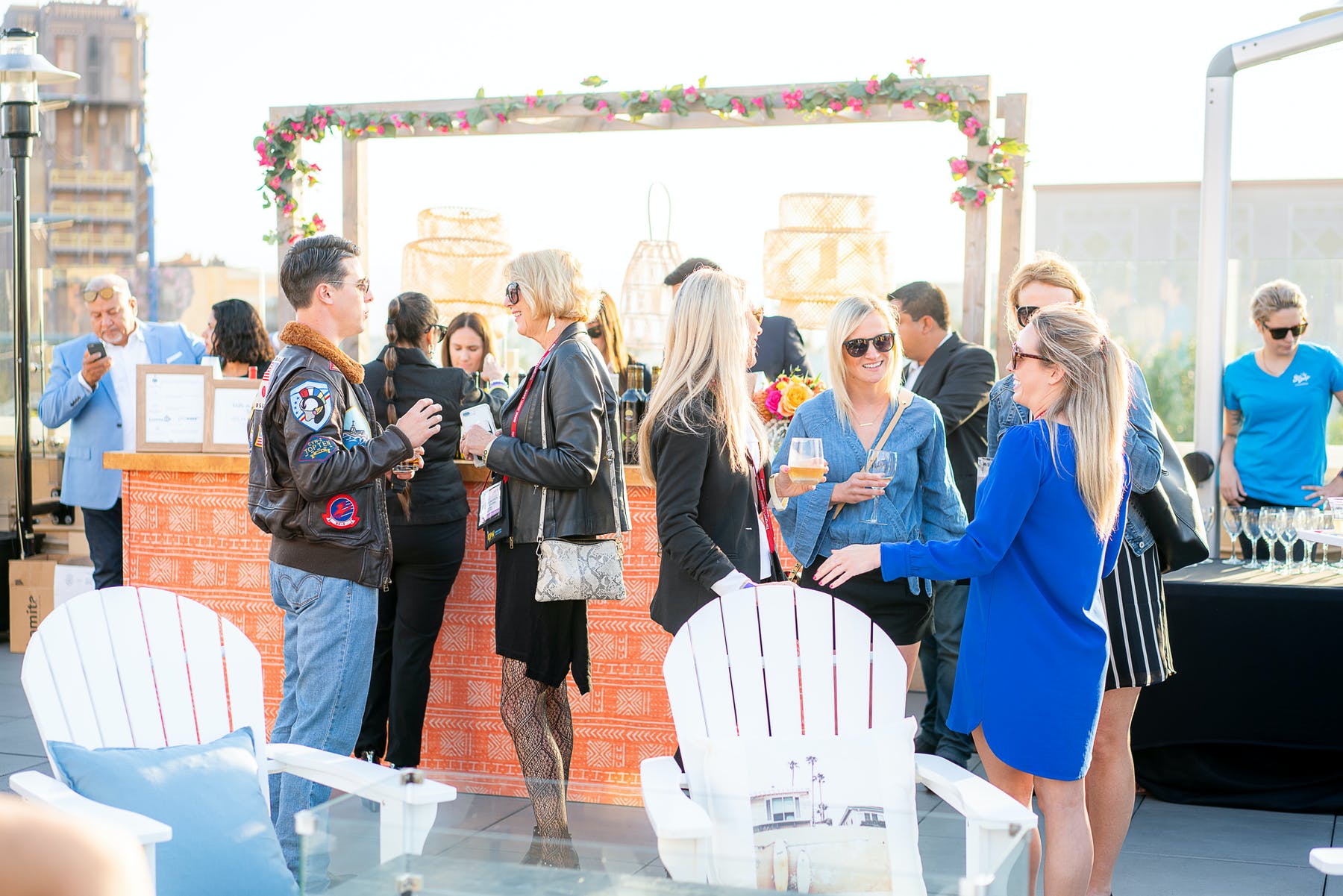 a group of people standing around a table