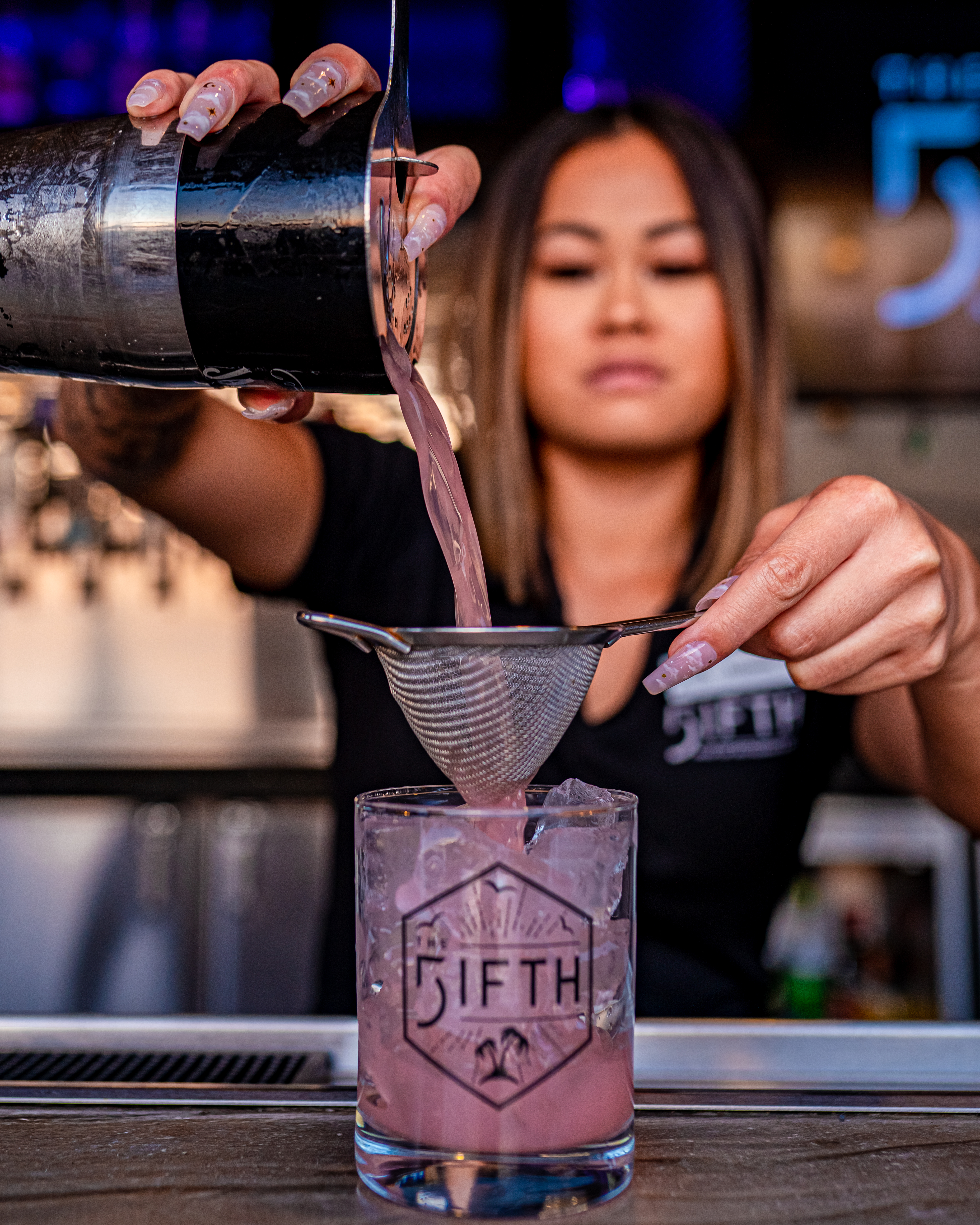 bartender pouring cocktail