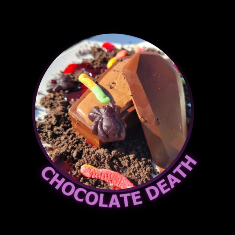 Chocolate Death: Homemade chocolate coffinfilled with chocolate mousseOreo® crumbleraspberry Puréegummy worms