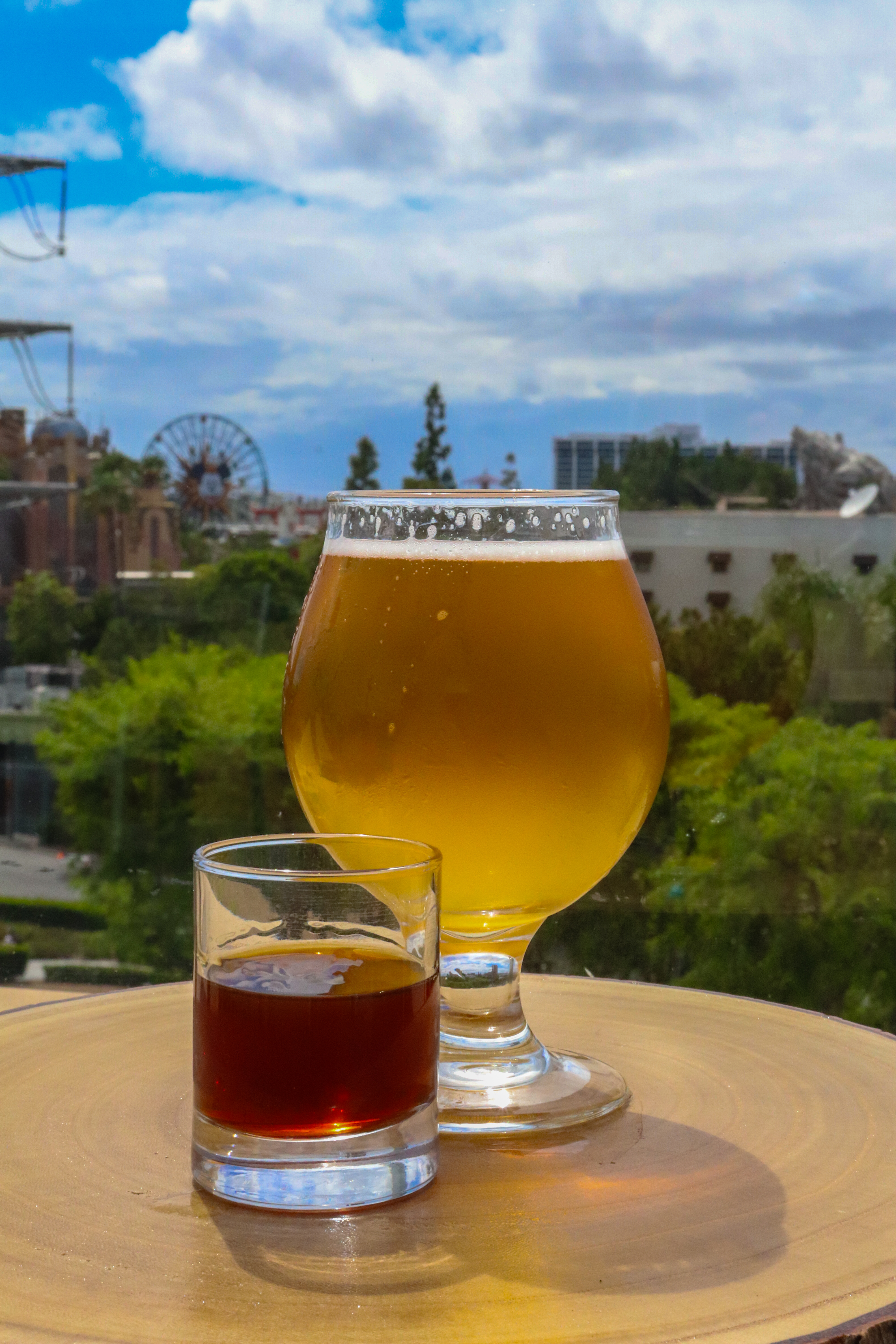 One full glass of beer and a small glass of dark amaro liquid