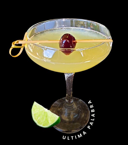 Ultima Palabra. Image: coup glass with green/yellow cocktail with cherry garnish and lime graphic