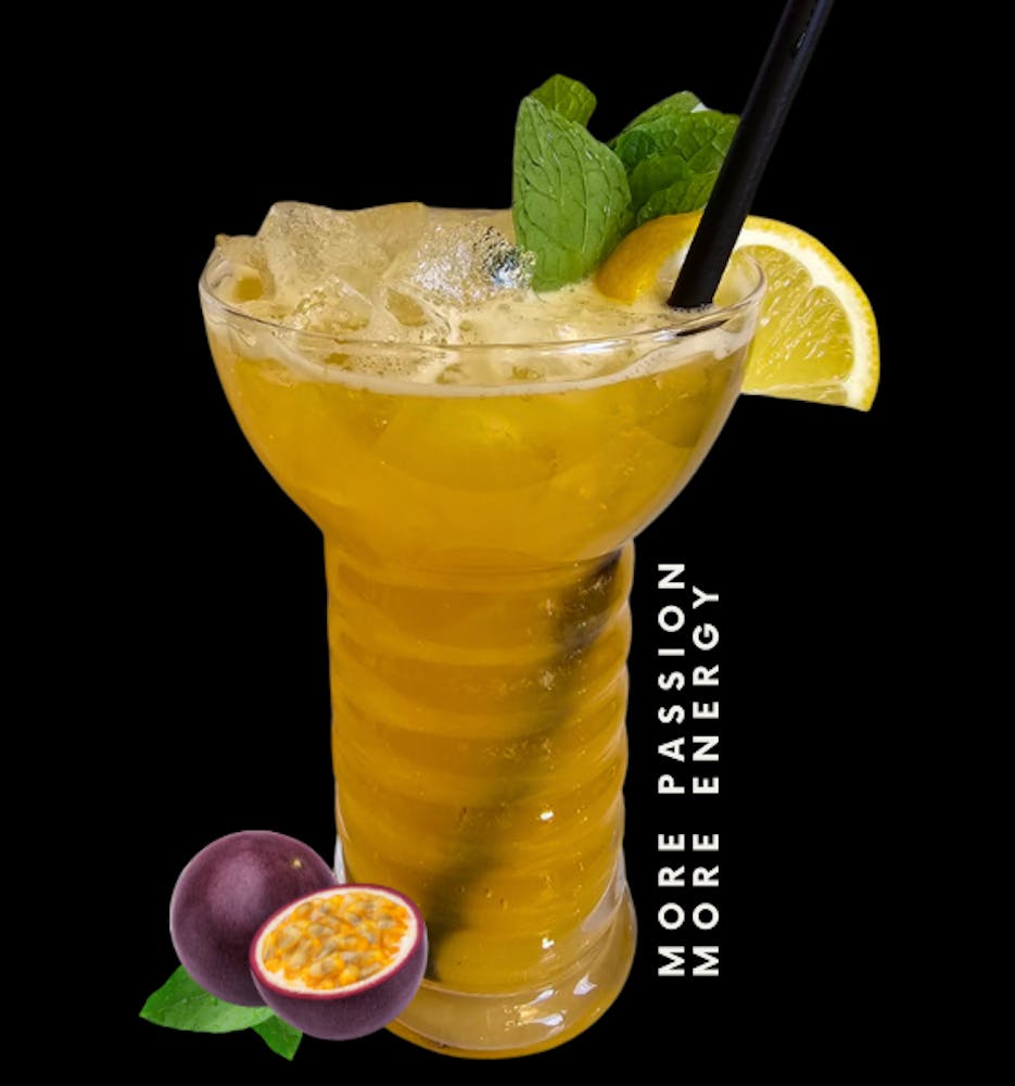 More Passion, More Energy. Image: orange cocktail with mint and lemon garnish featuring passion fruit graphic