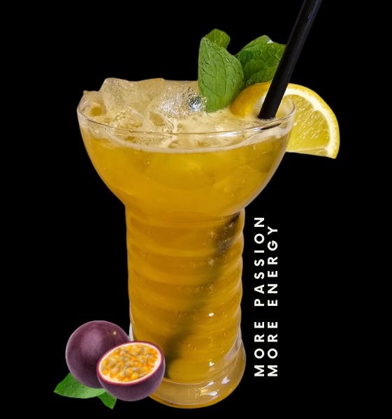 More Passion, More Energy. Image: orange cocktail with mint and lemon garnish featuring passion fruit graphic