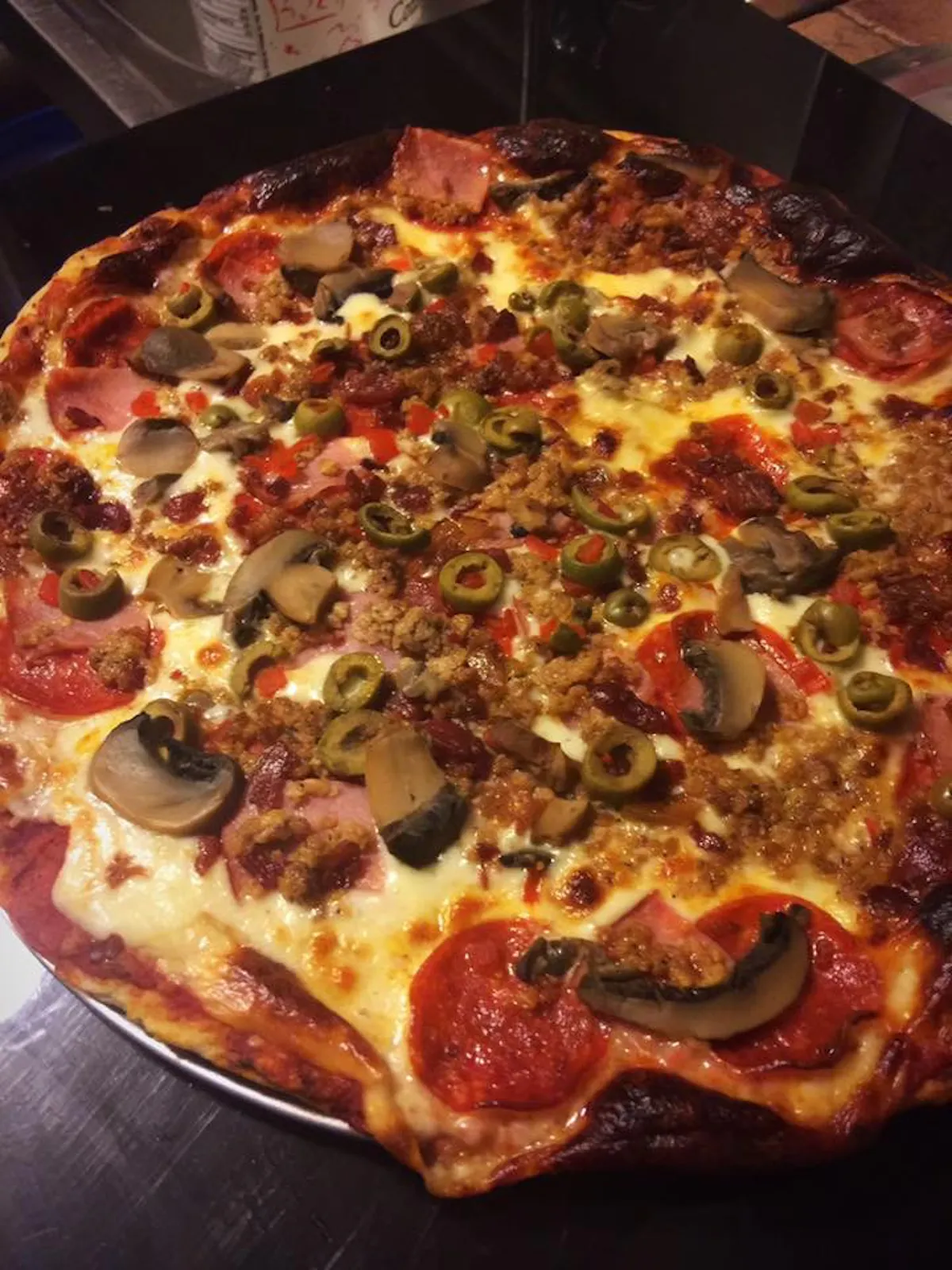 a pizza sitting on top of a table