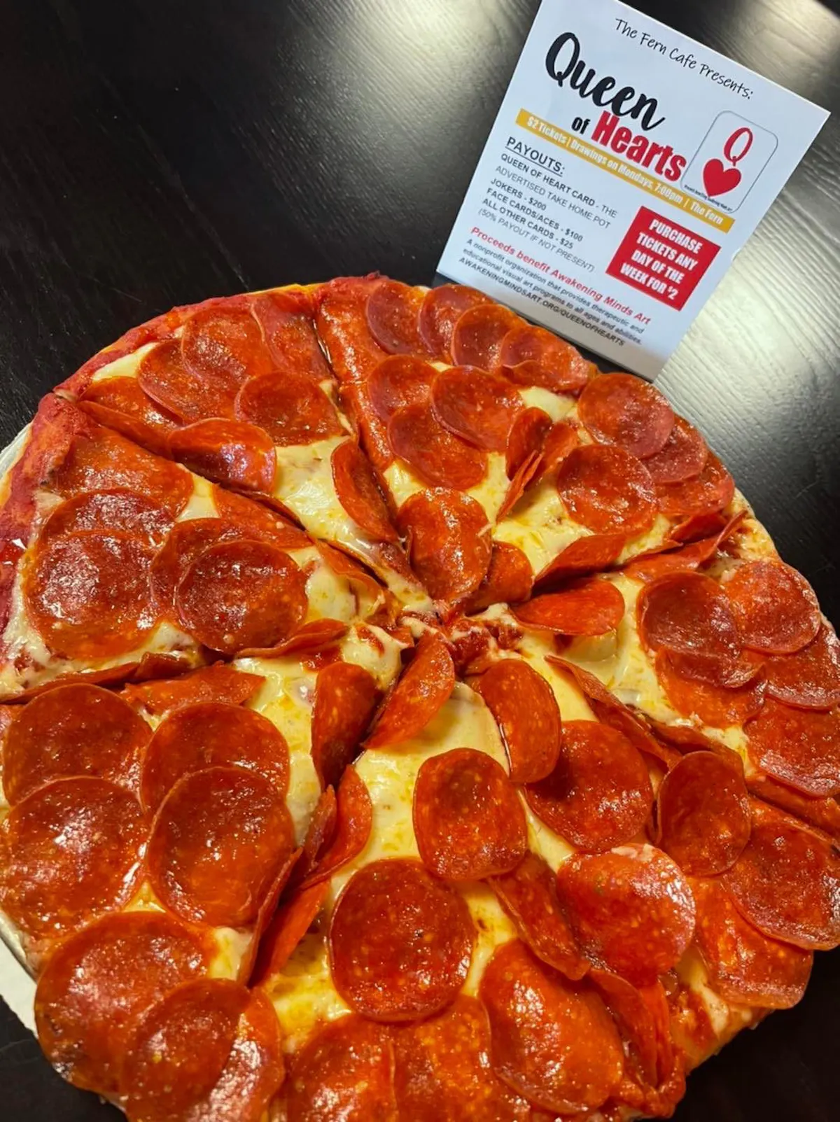 a slice of pepperoni pizza on a table