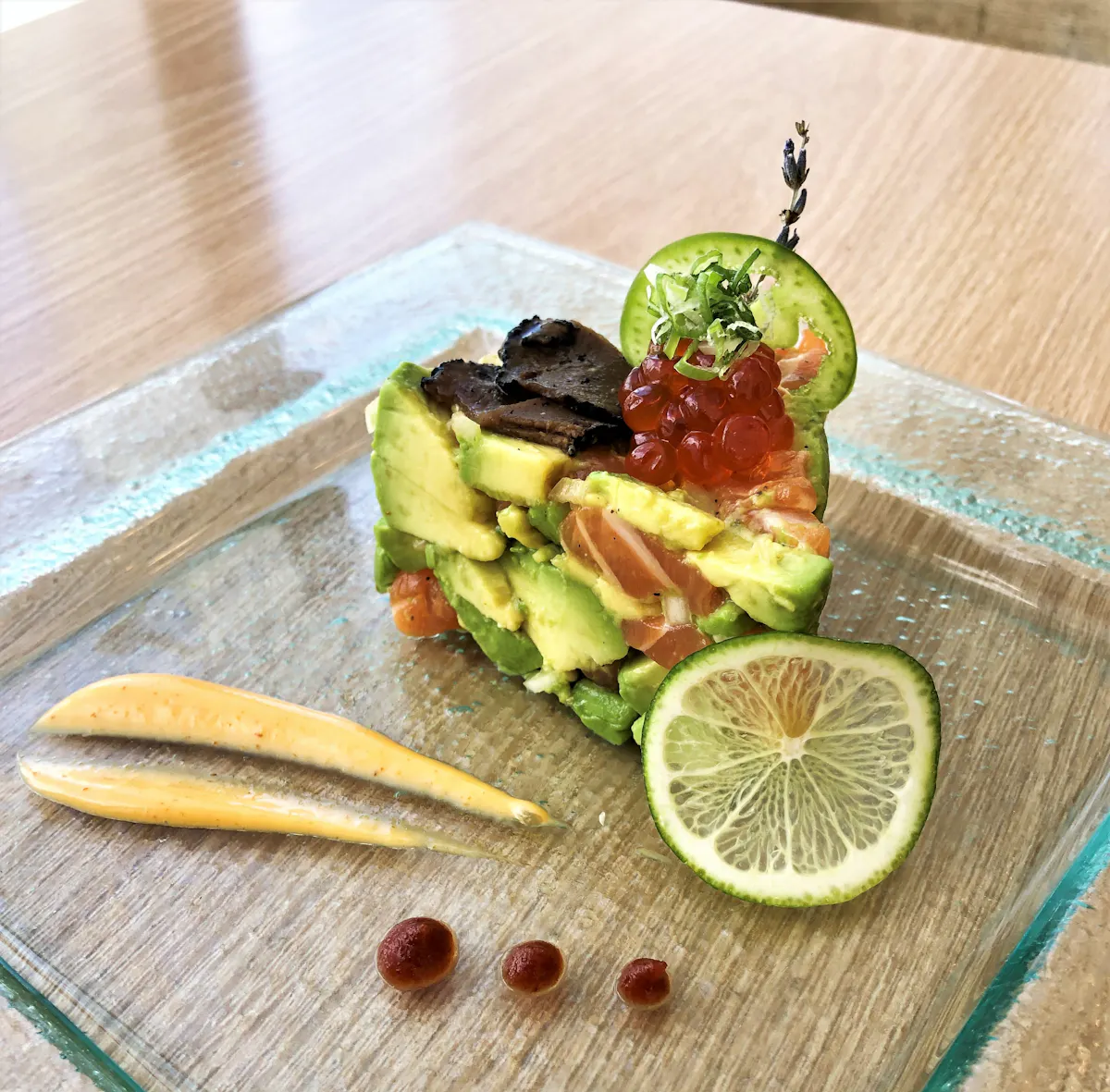 a plate of food sitting on top of a wooden table