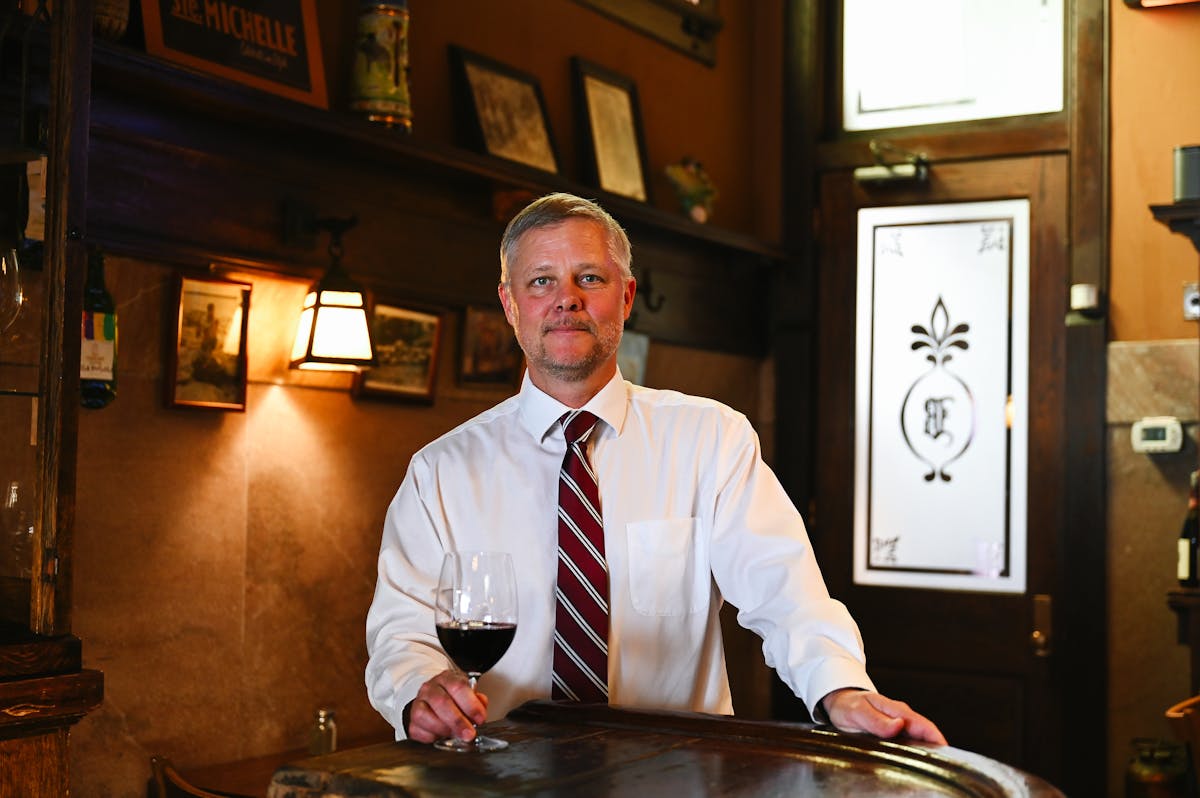a man standing in front of a table