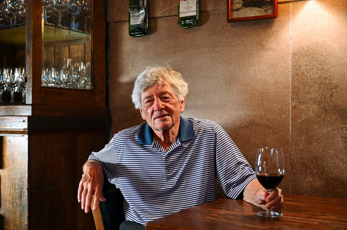 a person holding a glass of wine