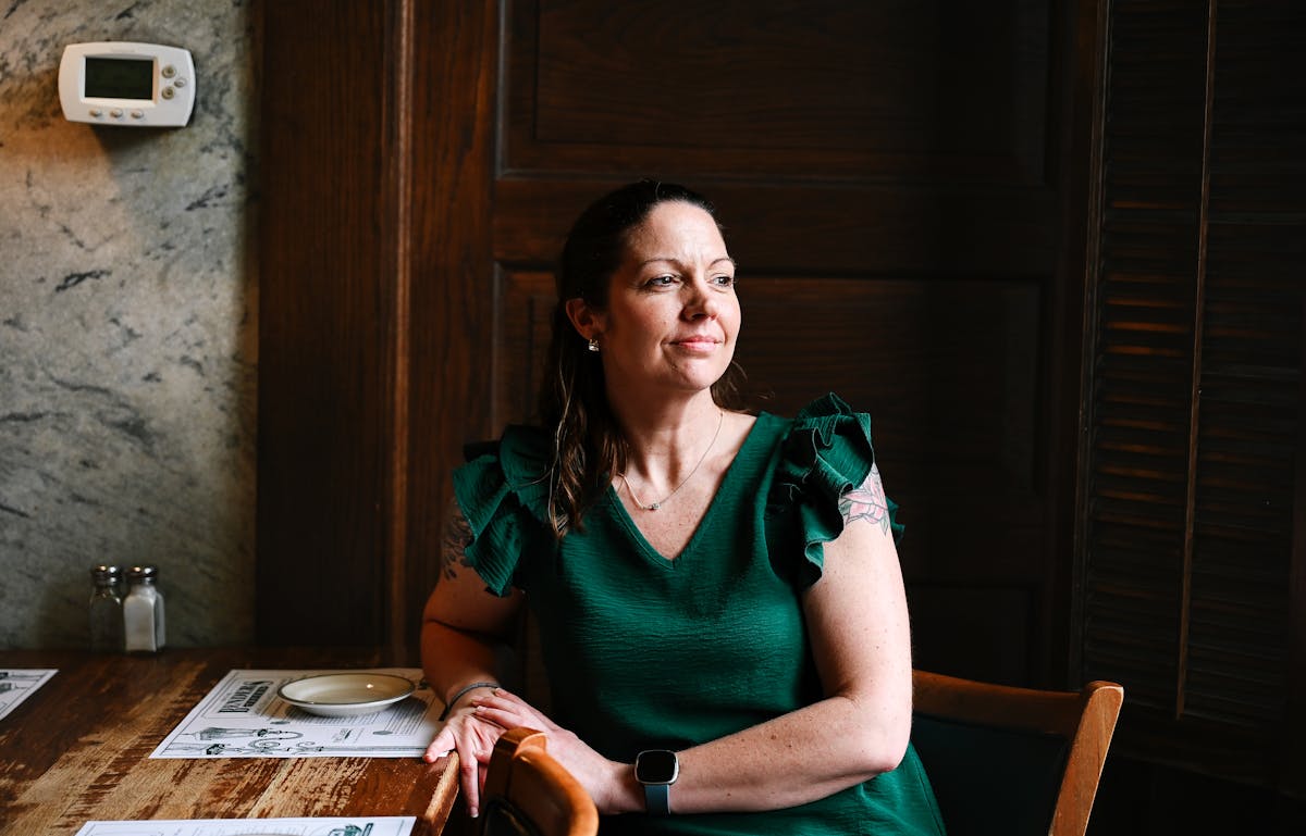 a woman sitting on a table