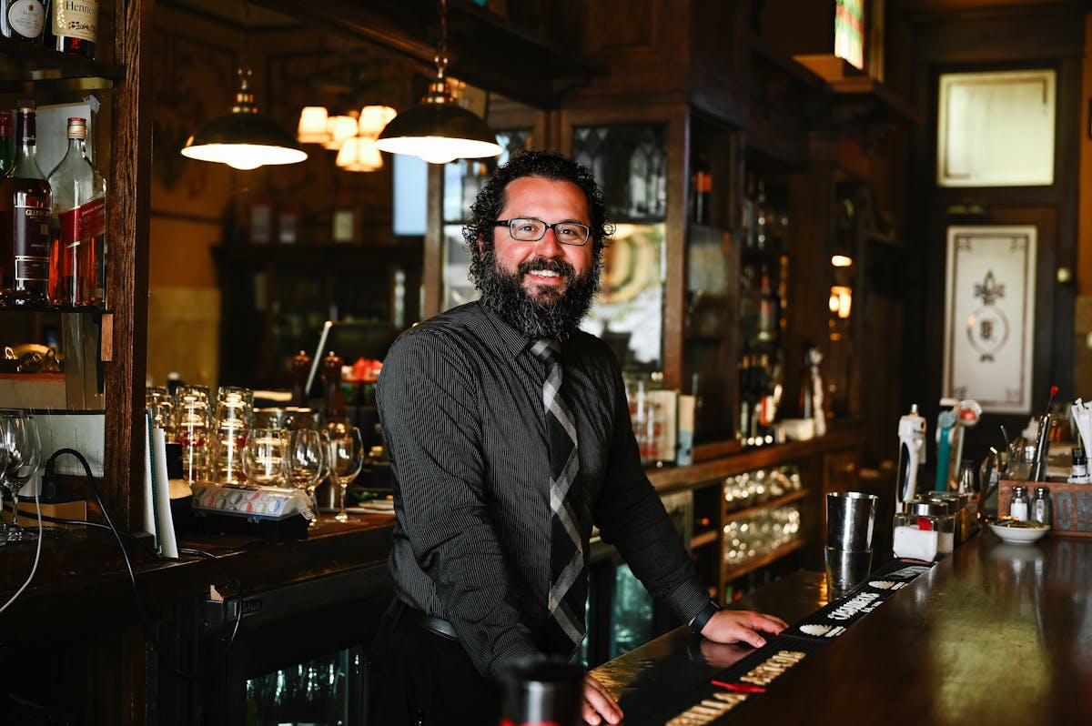 a man sitting at a table in a restaurant