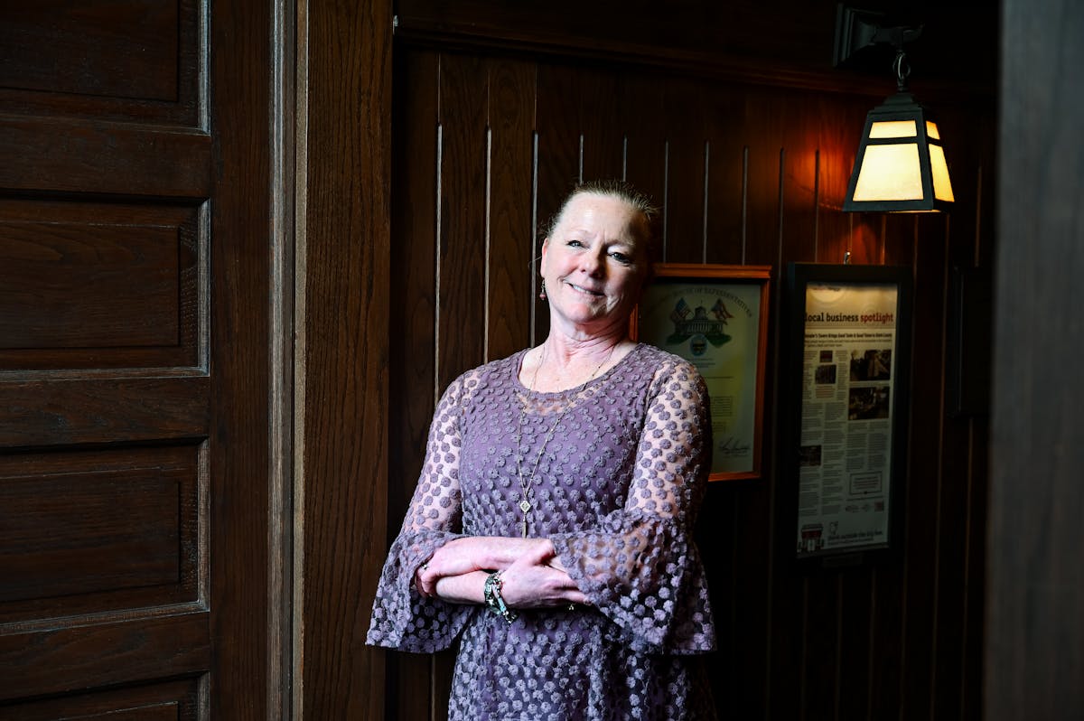 Donna Williams standing in front of a door