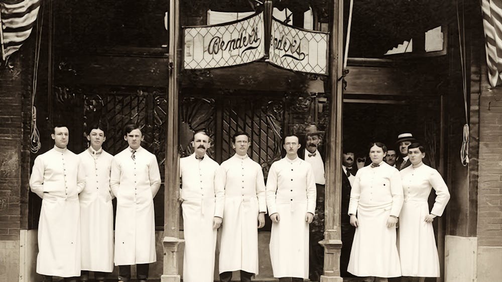 a group of men posing for the camera