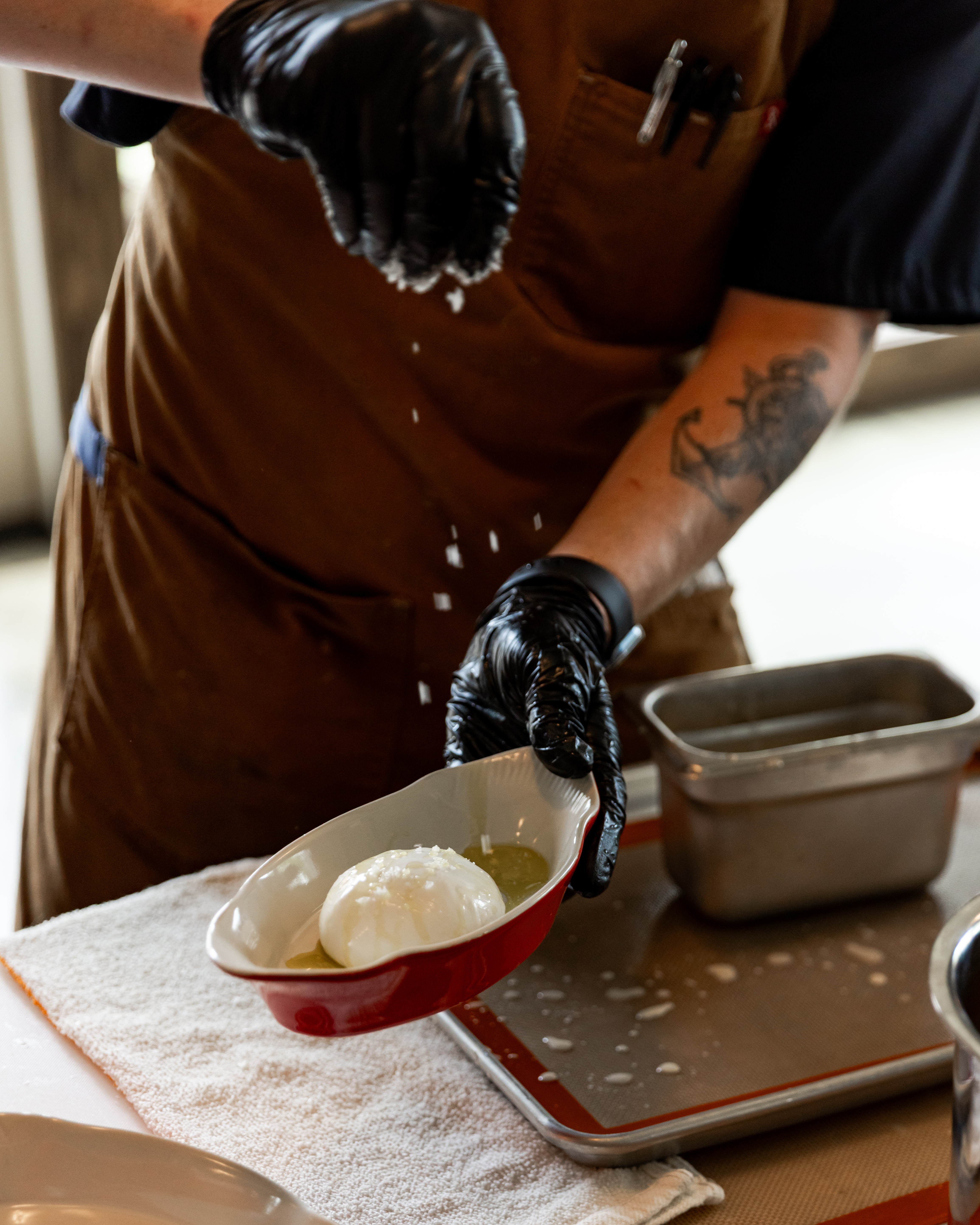 a person cutting food on a table