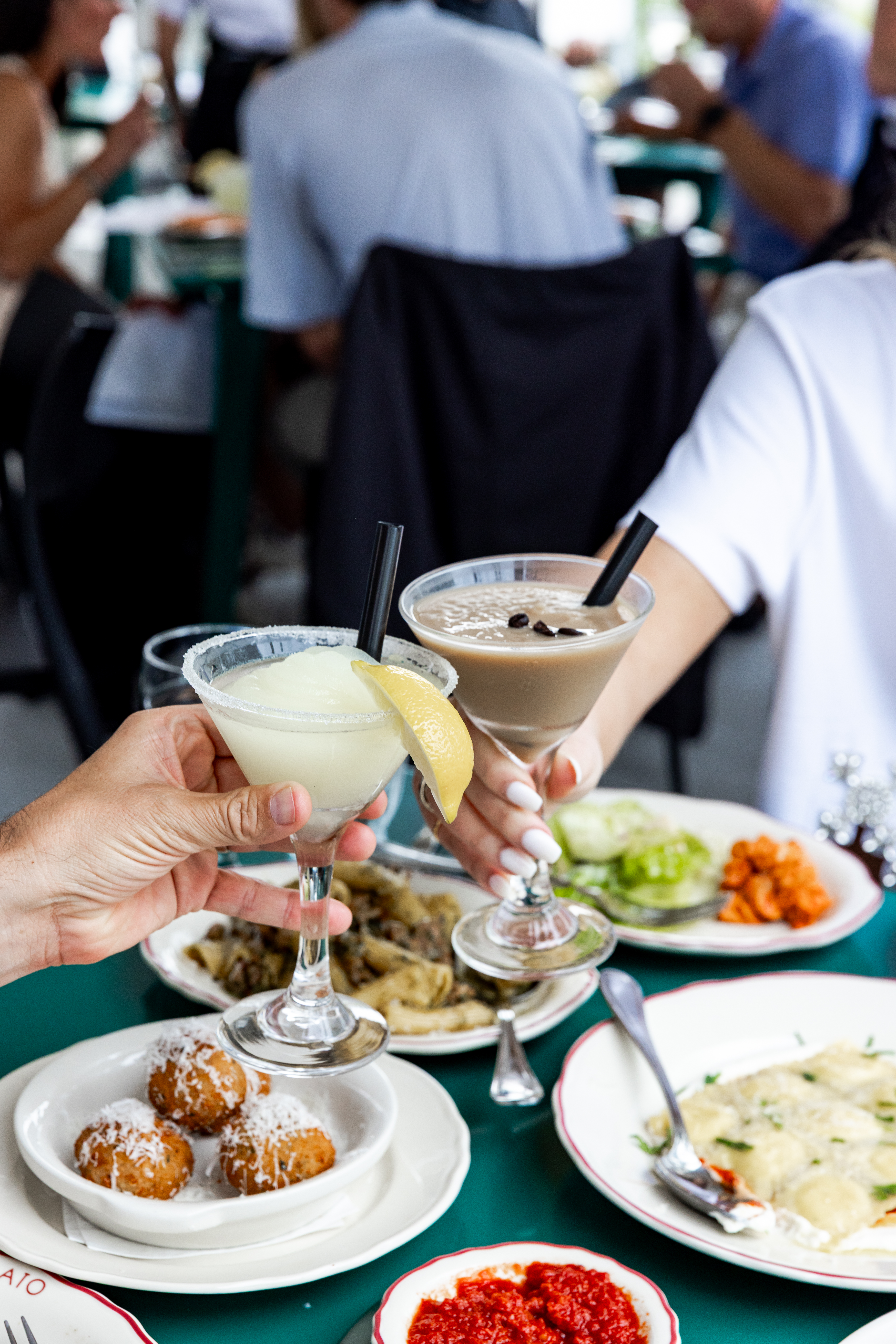 a person sitting at a table with a plate of food
