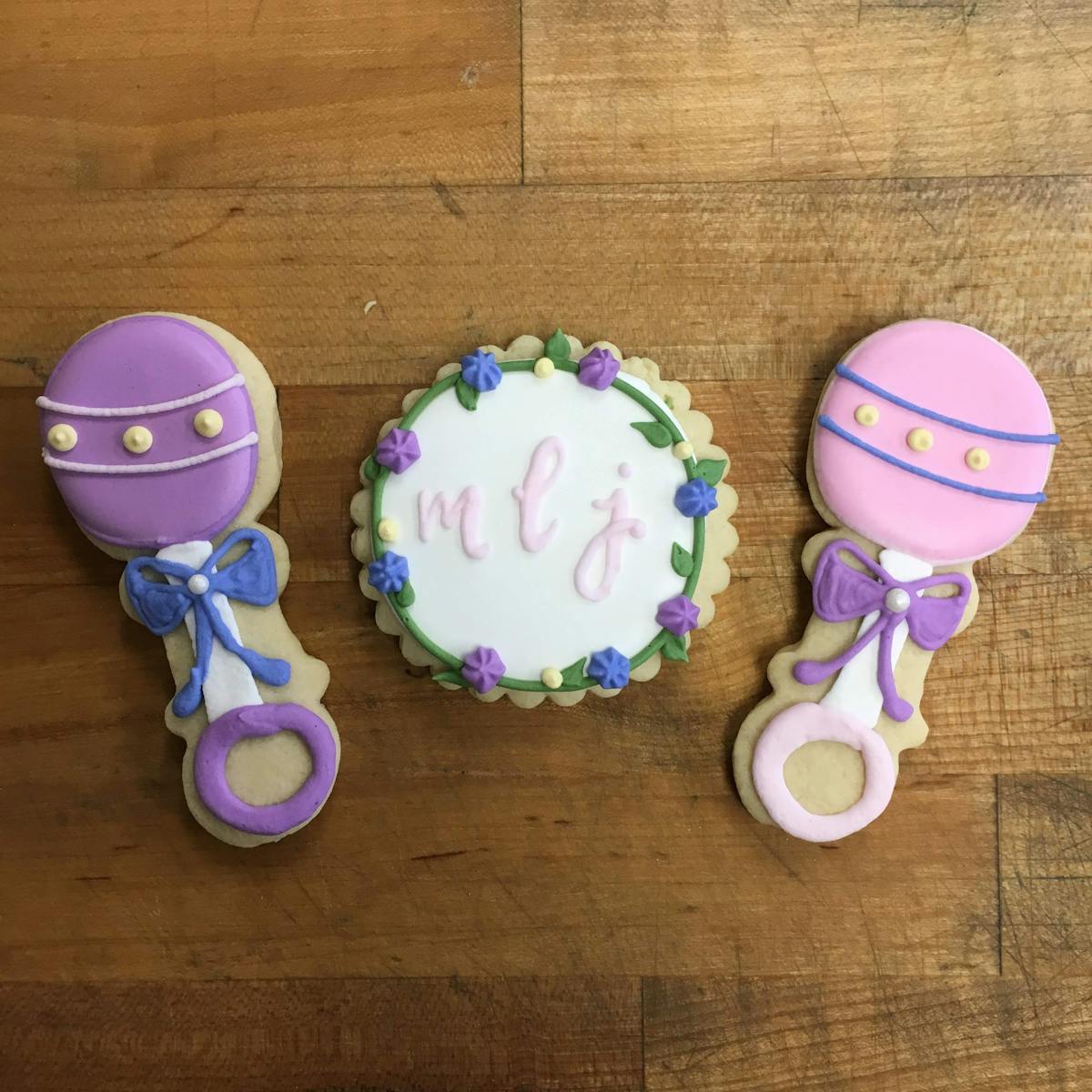 multiple decorated cookies sitting on a table