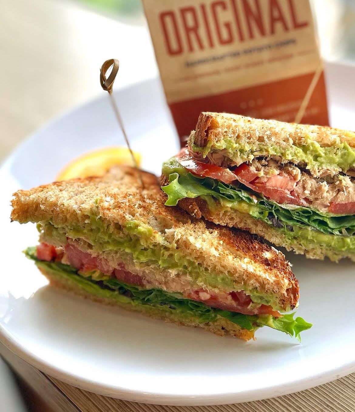 a sandwich cut in half on a plate