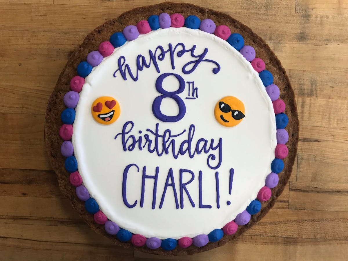 a cake sitting on top of a wooden table