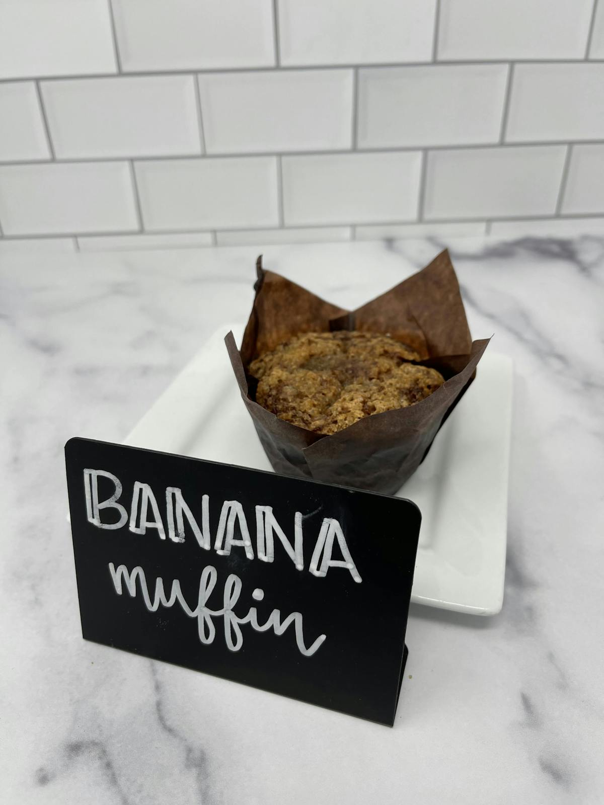 a cake sitting on top of a sign