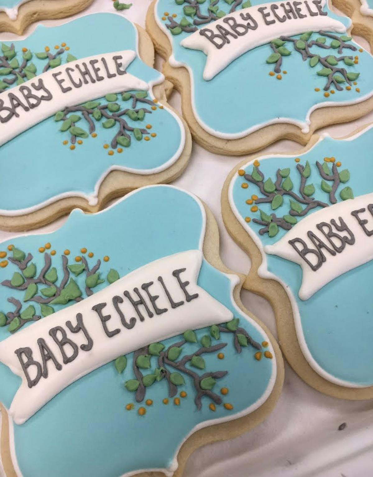 multiple decorated cookies sitting on a table
