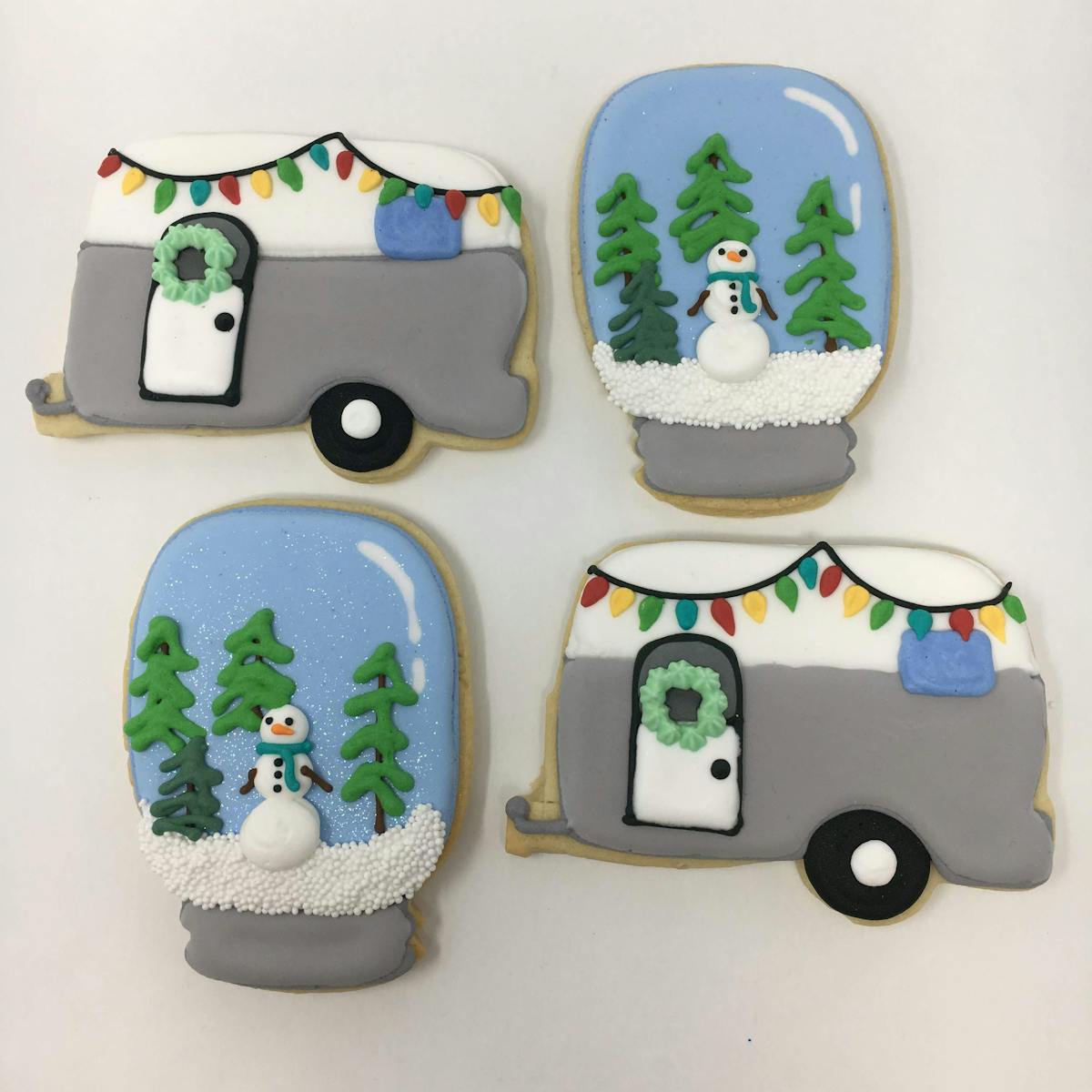 christmas camper and snowglobe decorated cookies