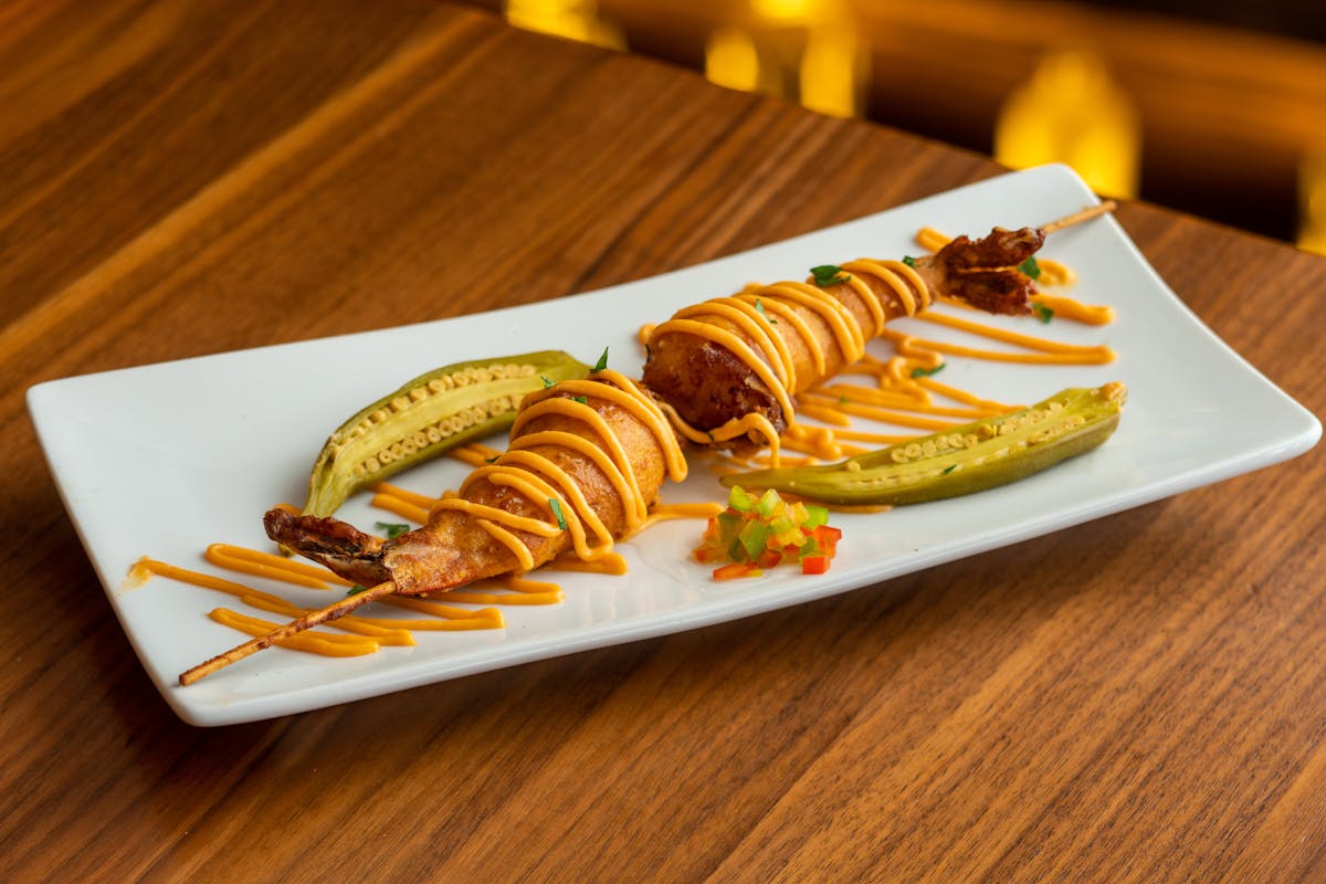 a plate of food sitting on top of a wooden table