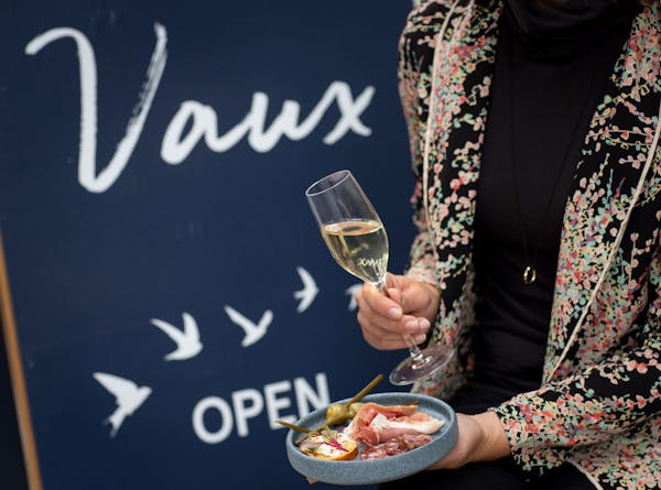 a person holding a wine glass