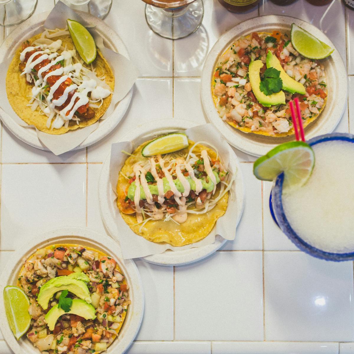 a table topped with plates of food