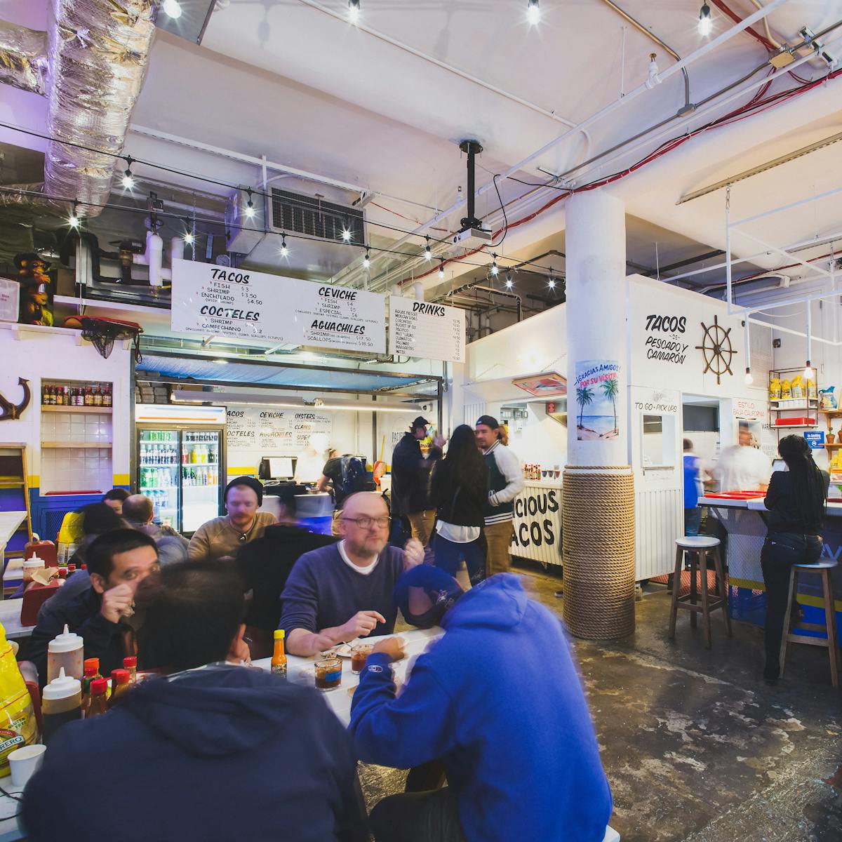 a group of people eating and chatting