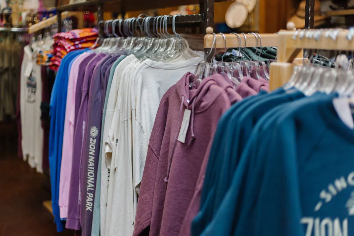 A store with many shirts and sweaters =