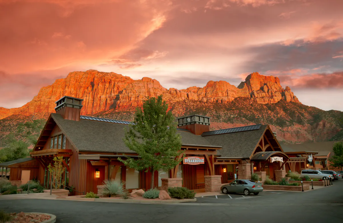 a house with a mountain in the background