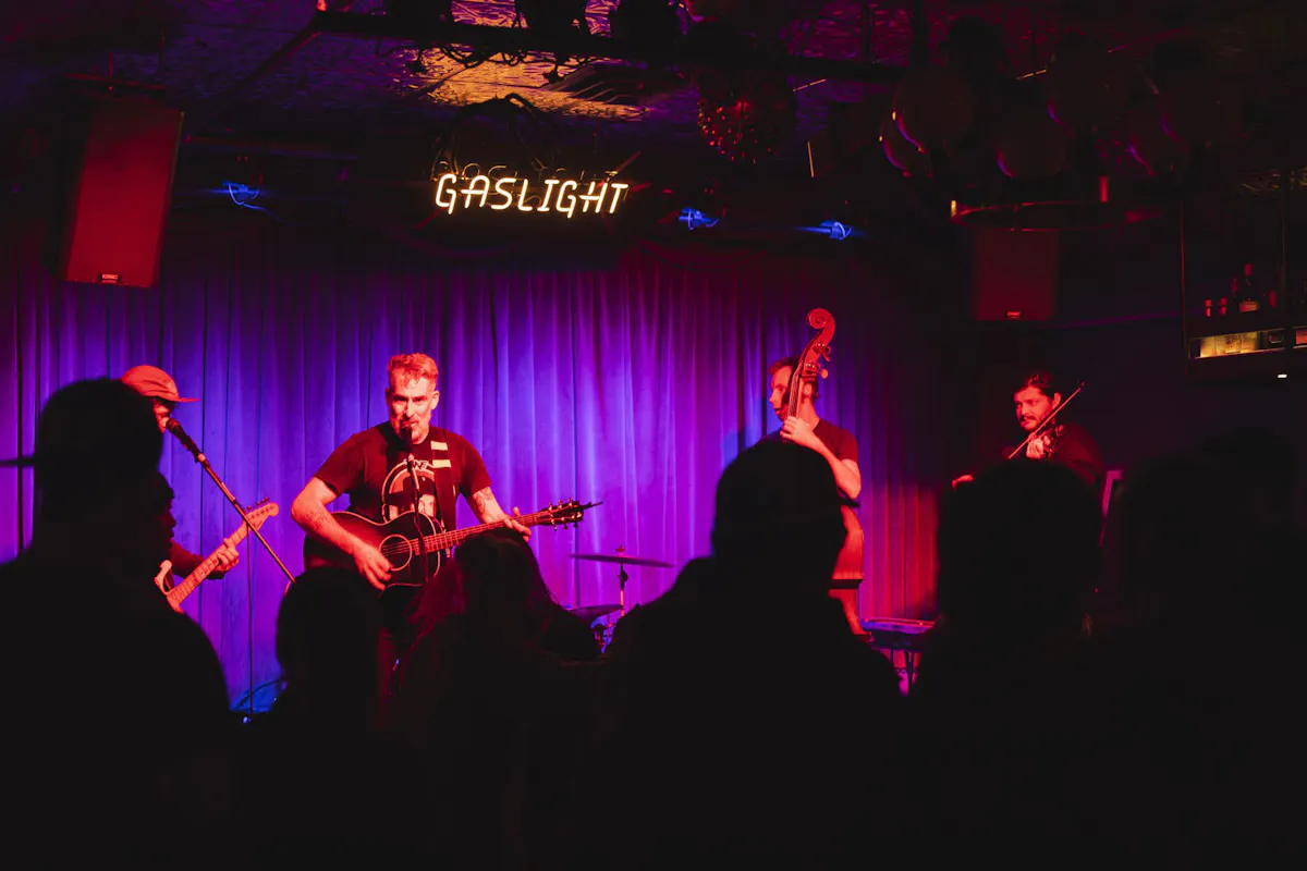 a group of people standing in front of a stage