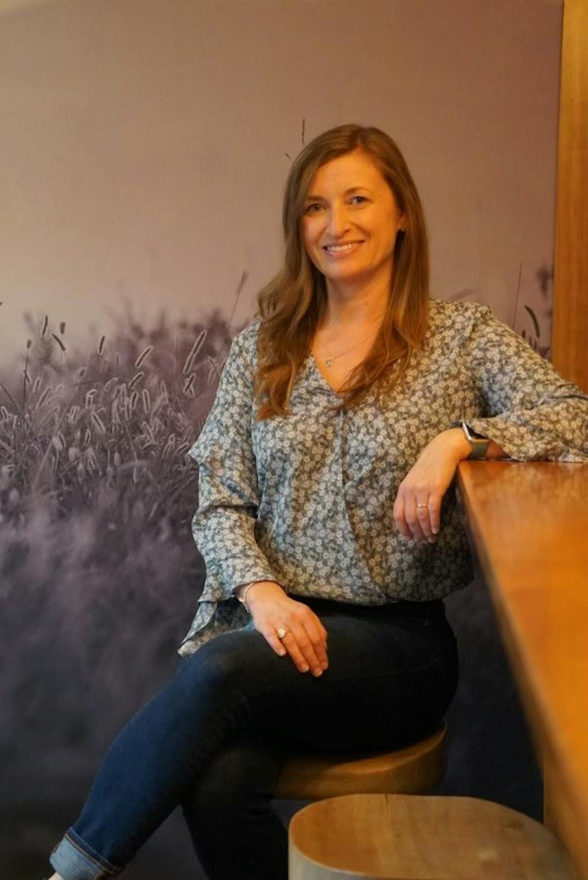 a woman sitting on a table