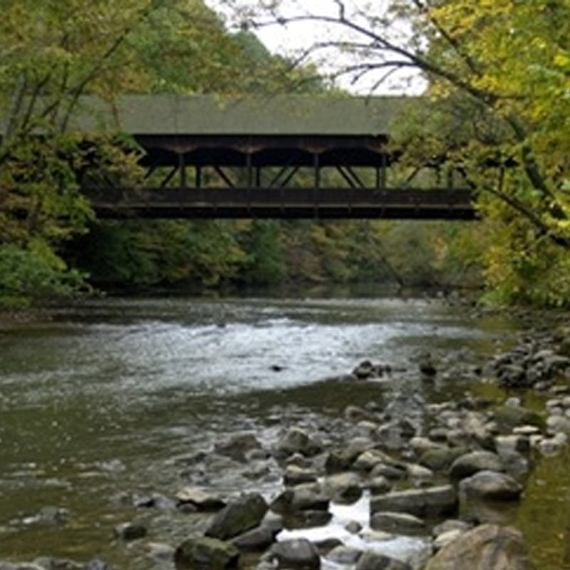 a stone bridge over a body of water