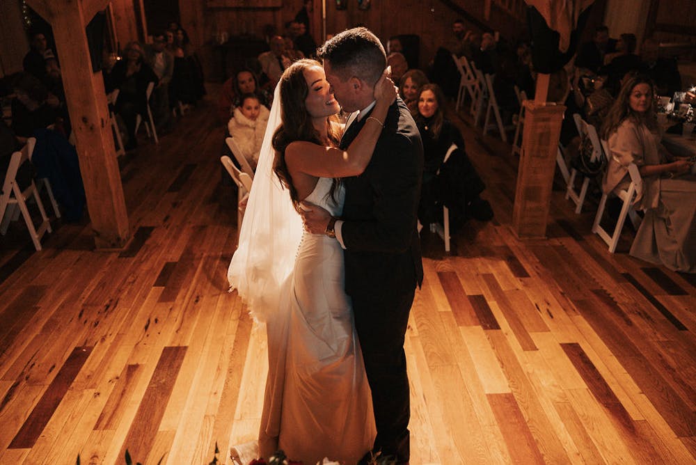 a group of people standing on top of a wooden floor