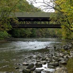 a stone bridge over a body of water