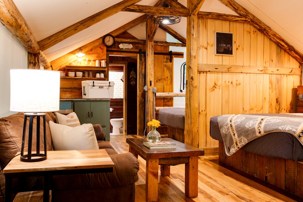 a living area with wooden wheels in a room