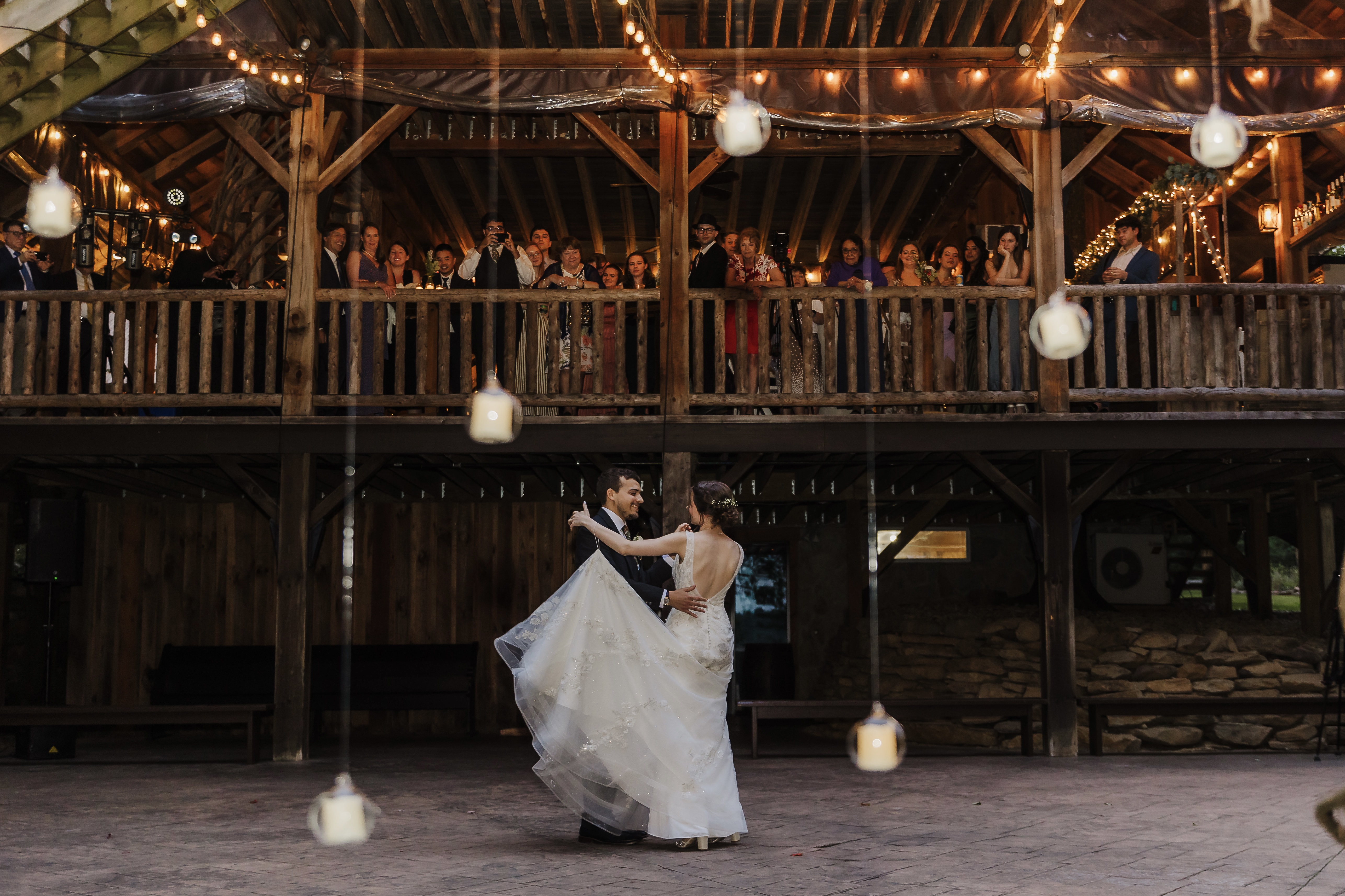 a group of people performing on stage in front of a building