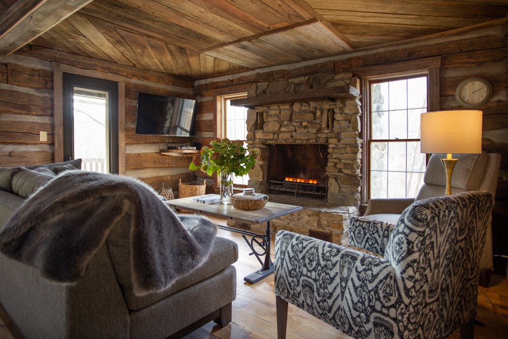 a living room filled with furniture and a fire place