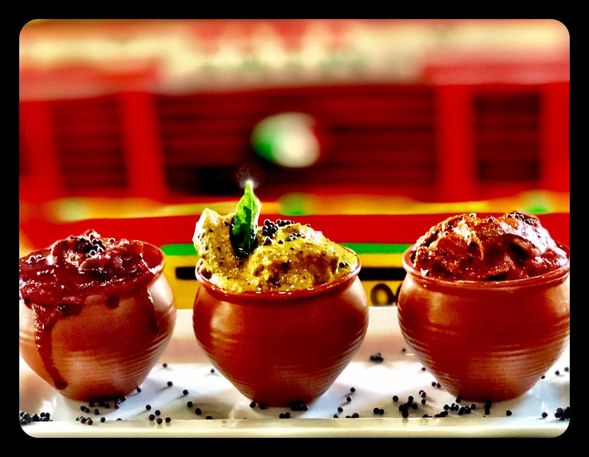 three bowls of food on a table