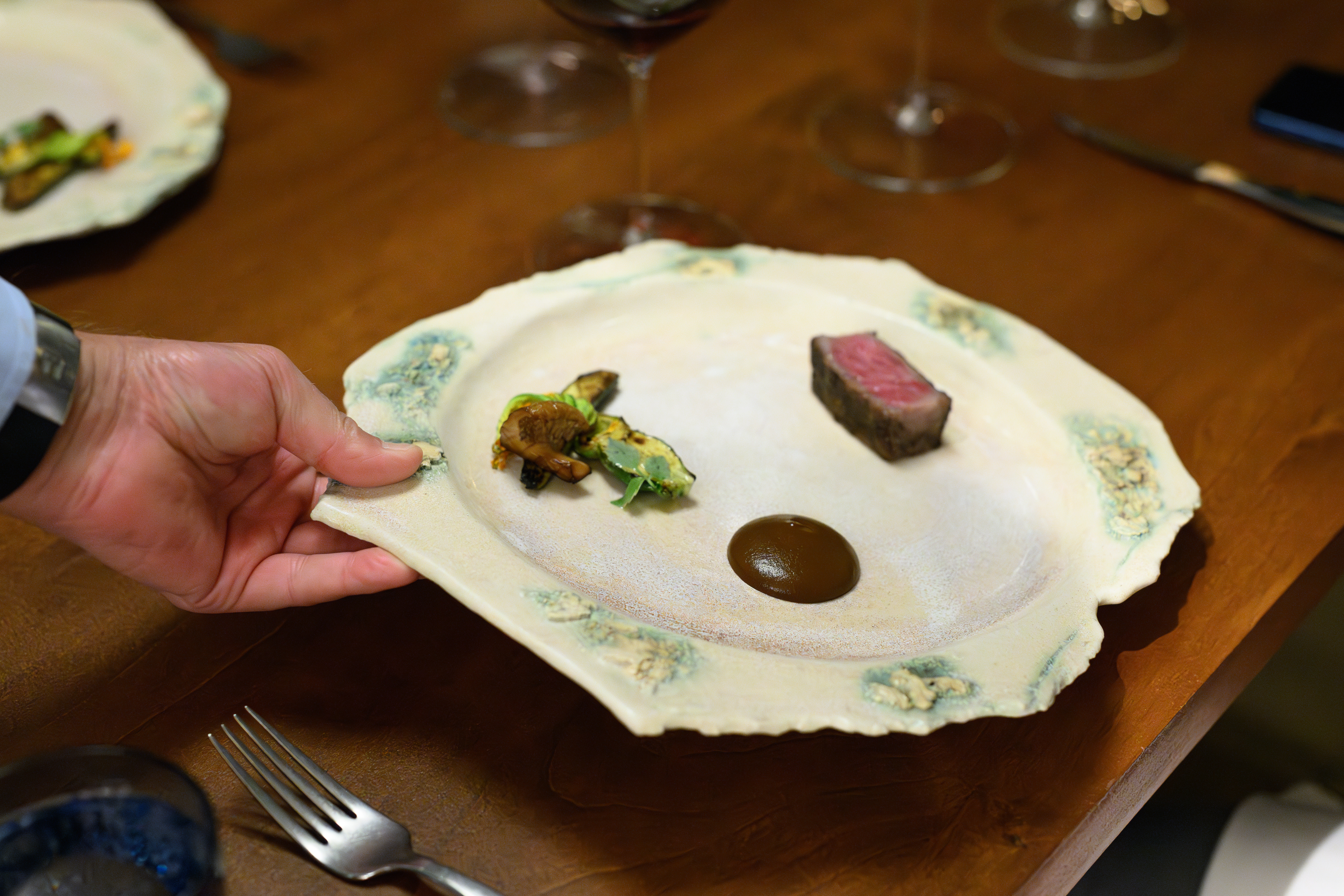 a plate of food being placed on a table