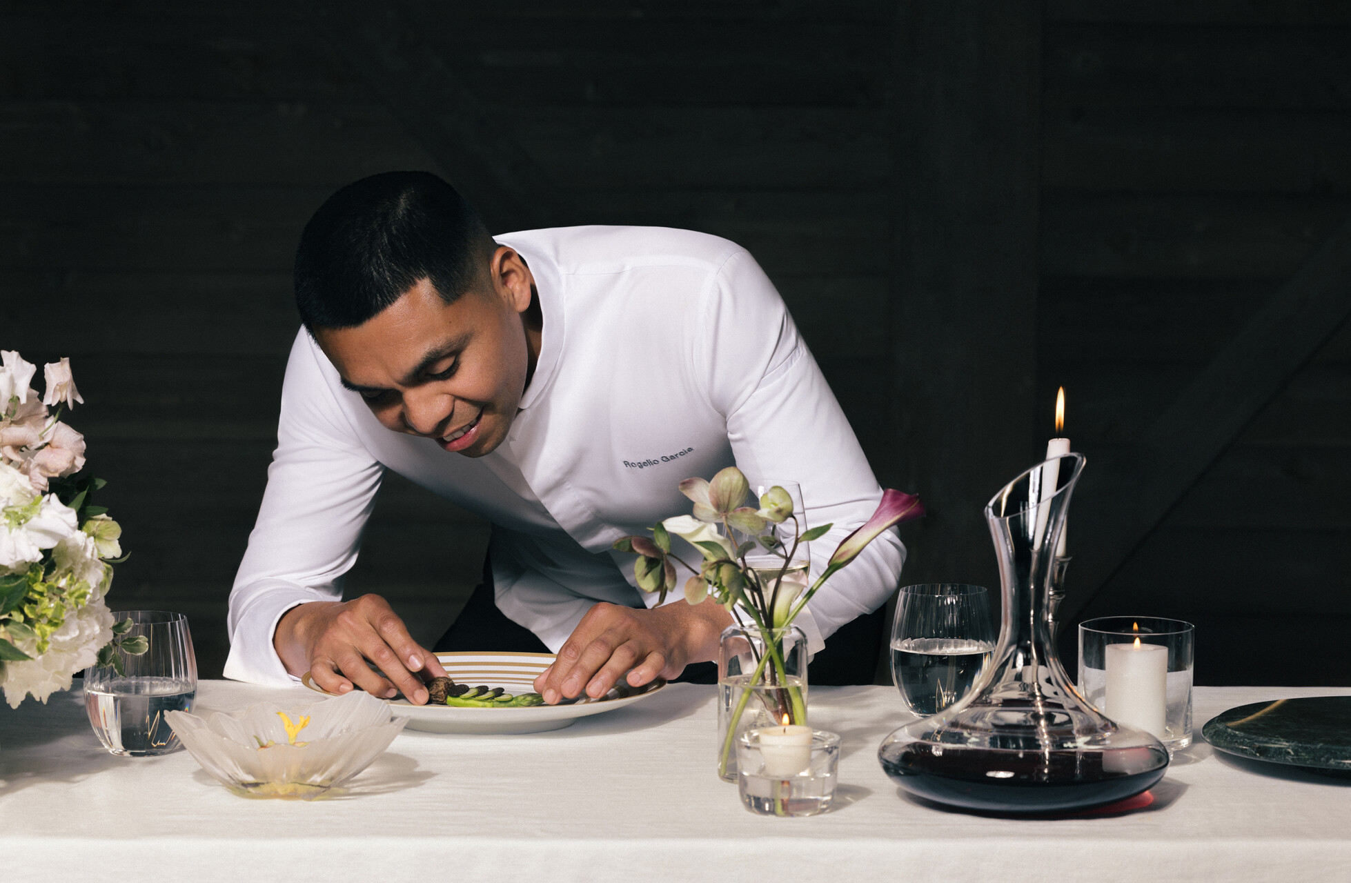 a man sitting at a table with a plate of food