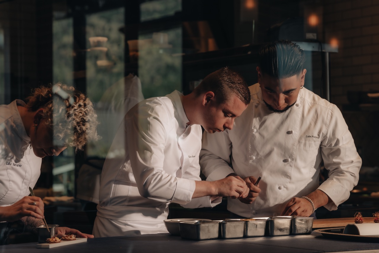 a group of chefs in a kitchen