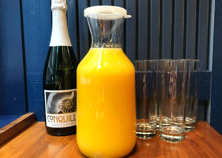 Orange juice, champagne and glasses