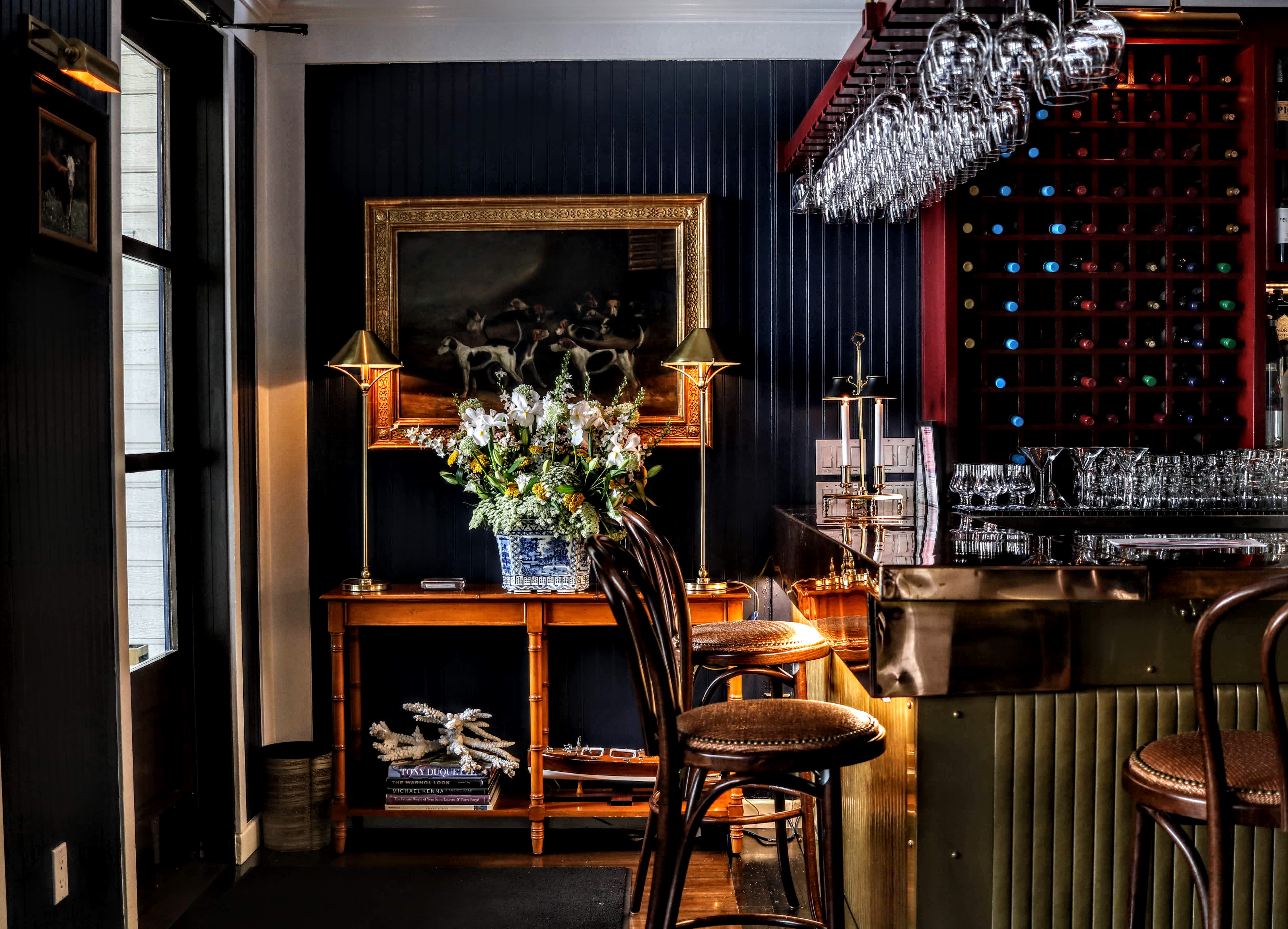 a room filled with furniture and a fire place sitting in a chair