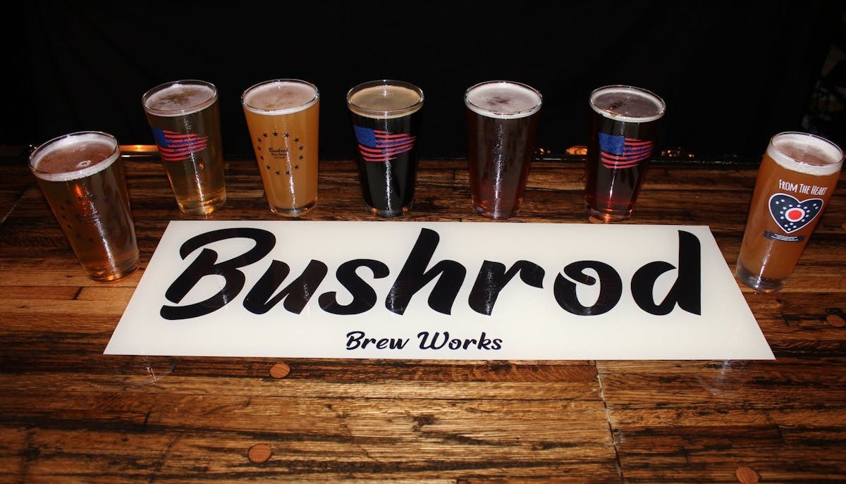 a row of beers and the title Bushrod on the table